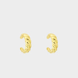 a croissant ear cuff in 18k gold plated silver. The ear cuff features a unique croissant-shaped design that wraps around the earlobe. It is made of high-quality gold plated silver with a polished finish, giving it a luxurious and elegant look. The cuff is designed to be worn without the need for a piercing, making it a trendy and versatile accessory.