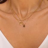 A layered necklaces set that includes a labradorite stone pendant necklace, moon necklace and a satellite chain in 18k gold plated silver. The set features a stunning labradorite stone pendant necklace, crafted with a beautiful gold bezel and suspended from a delicate gold chain. Along with the labradorite stone pendant necklace, the set also includes a stylish satellite chain, that adds a trendy and modern touch to the jewelry collection.