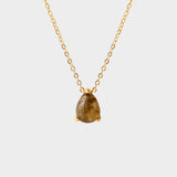 A labradorite stone pendant necklace in 18k gold plated silver. The necklace features a stunning labradorite stone pendant that is beautifully crafted and set in a gold bezel. The labradorite stone exhibits vibrant shades of grey with unique patterns, creating a captivating and natural look. The pendant is suspended from a delicate gold chain, adding elegance and sophistication to the necklace