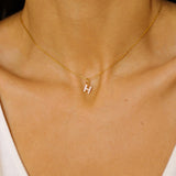 An initial pendant necklace in 18k gold plated silver. The necklace features a delicate gold chain, with a pendant in the shape of a single letter H from the alphabet. The pendant is intricately designed, showcasing the initial with a stylish and elegant font. Perfect for gifting or adding a personal touch to any outfit.