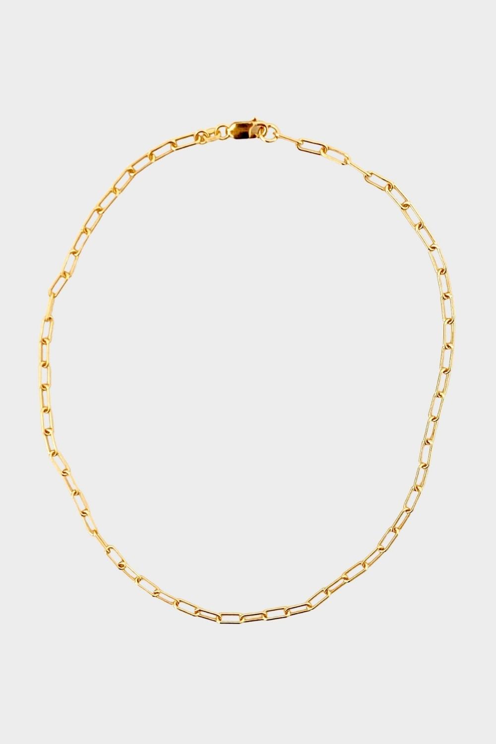 18k gold plated over sterling silver paper clip chain choker. The choker is composed of interlocking paper clip-shaped links, with each link carefully plated in 18k gold for a luxurious and radiant shine. The paper clip chain design gives the necklace a trendy and contemporary look. The choker is designed to sit comfortably around the neck, creating a stylish and fashionable accessory that can be worn alone or layered with other necklaces