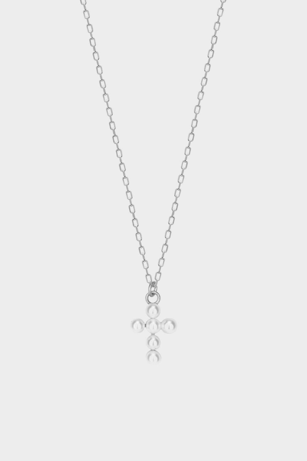 Pearl cross pendant necklace in 925 sterling silver. The necklace features a delicate silver chain with a pendant in the shape of a cross. The cross pendant is adorned with lustrous white pearls, adding a touch of elegance and femininity to the design. The necklace is crafted with meticulous attention to detail, creating a timeless and religious-inspired piece of jewelry. It can be worn as a symbolic accessory or as a fashionable statement piece.