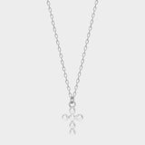 Pearl cross pendant necklace in 925 sterling silver. The necklace features a delicate silver chain with a pendant in the shape of a cross. The cross pendant is adorned with lustrous white pearls, adding a touch of elegance and femininity to the design. The necklace is crafted with meticulous attention to detail, creating a timeless and religious-inspired piece of jewelry. It can be worn as a symbolic accessory or as a fashionable statement piece.