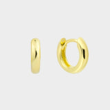 plain huggie hoops in 18k gold plated silver. The earrings feature a classic huggie-style design with a simple and sleek look. The hoops are made of high-quality gold plated silver and have a polished finish