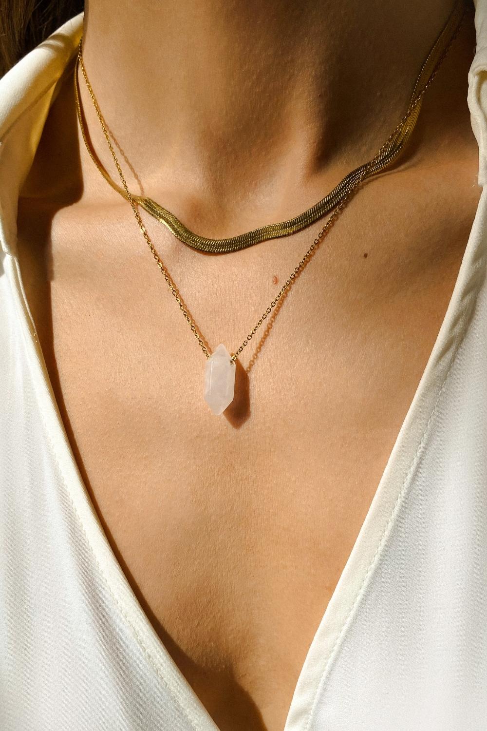 A layered set of herringbone flat chains in 18k gold plated. The set includes three gold chains with a distinct herringbone pattern, all crafted in a luxurious gold color. The chains are layered together, creating a stylish and modern look. The herringbone pattern adds a unique texture and visual interest to the chains, while the gold color adds a touch of glamour