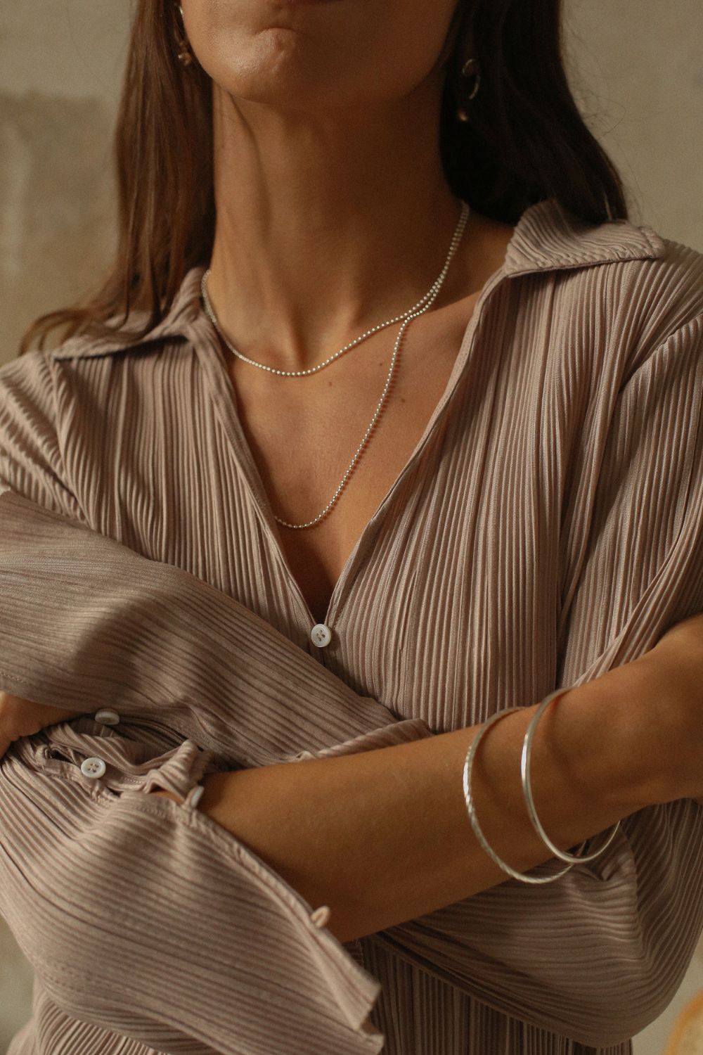 a silver cuff bracelet with a round shape. The bracelet is made entirely of silver, with a smooth and polished finish. This versatile silver cuff bracelet adds a touch of elegance and sophistication to any wrist.