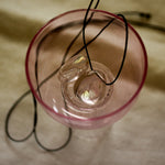 angel aura quartz stone necklace with an  black cord still life image