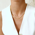 girl wearing gold rope chain 