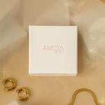 'AMICA JEWELS' jewelry box on a beige fabric background