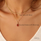 Gold rope chain necklace with a carnelian pendant on a person's neck, showing chain lengths.
