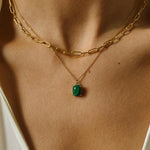 18k gold plated over sterling silver paper clip chain choker. The choker is composed of interlocking paper clip-shaped links, with each link carefully plated in 18k gold for a luxurious and radiant shine. The paper clip chain design gives the necklace a trendy and contemporary look. The choker is designed to sit comfortably around the neck, creating a stylish and fashionable accessory that can be worn alone or layered with other necklaces