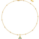 Gold necklace with a amazonite pendant on a white background