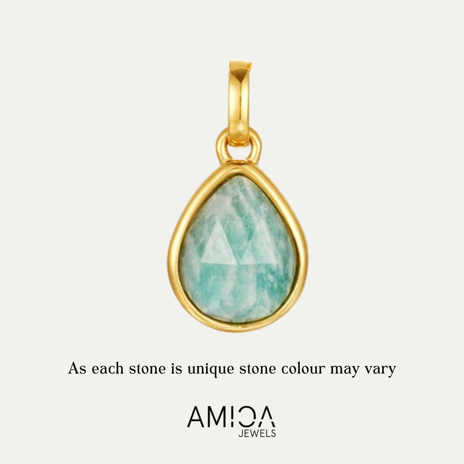 Gold pendant with a green gemstone on a light gray background, featuring the AMICA Jewels brand.