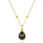Gold black obsidian necklace with a pendant on a white background