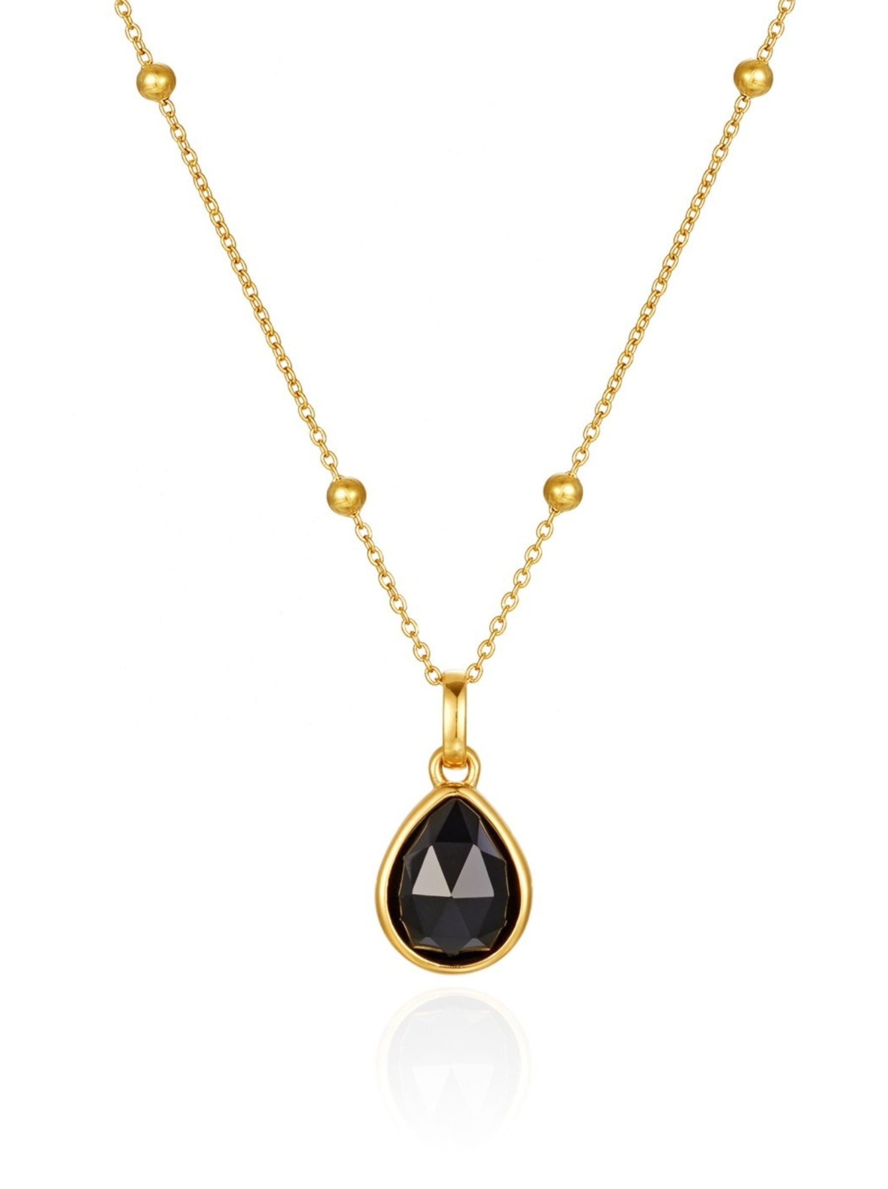 Gold black obsidian necklace with a pendant on a white background