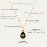 Gold necklace with black pendant on a white background, featuring AMICA Jewels branding.