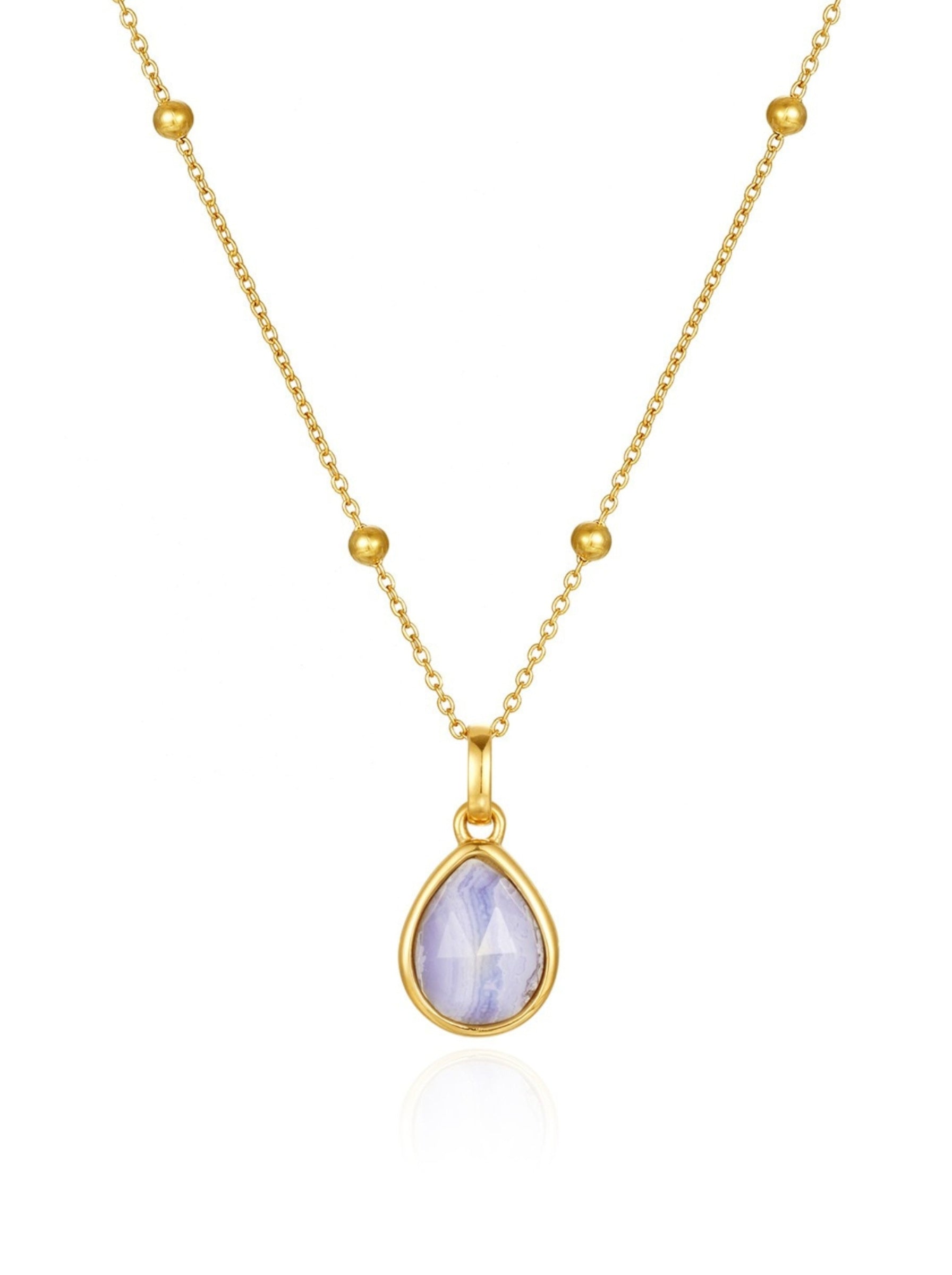 blue lace gold teardrop pendant on the white background