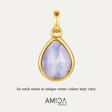 Gold pendant with a teardrop-shaped purple stone on a white background, featuring the AMICA Jewels brand.