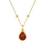 carnelian pendant necklace on white background
