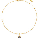 Gold necklace with a labradorite teardrop pendant on a white background