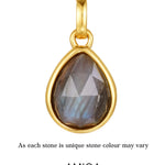 Gold pendant with a teardrop-shaped gemstone on a white background, featuring the AMICA Jewels brand.
