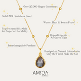 Gold necklace with pendant on a white background, featuring AMICA Jewels branding.