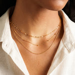 Layered gold satellite chain necklace styled with chain necklace – Amica Jewels