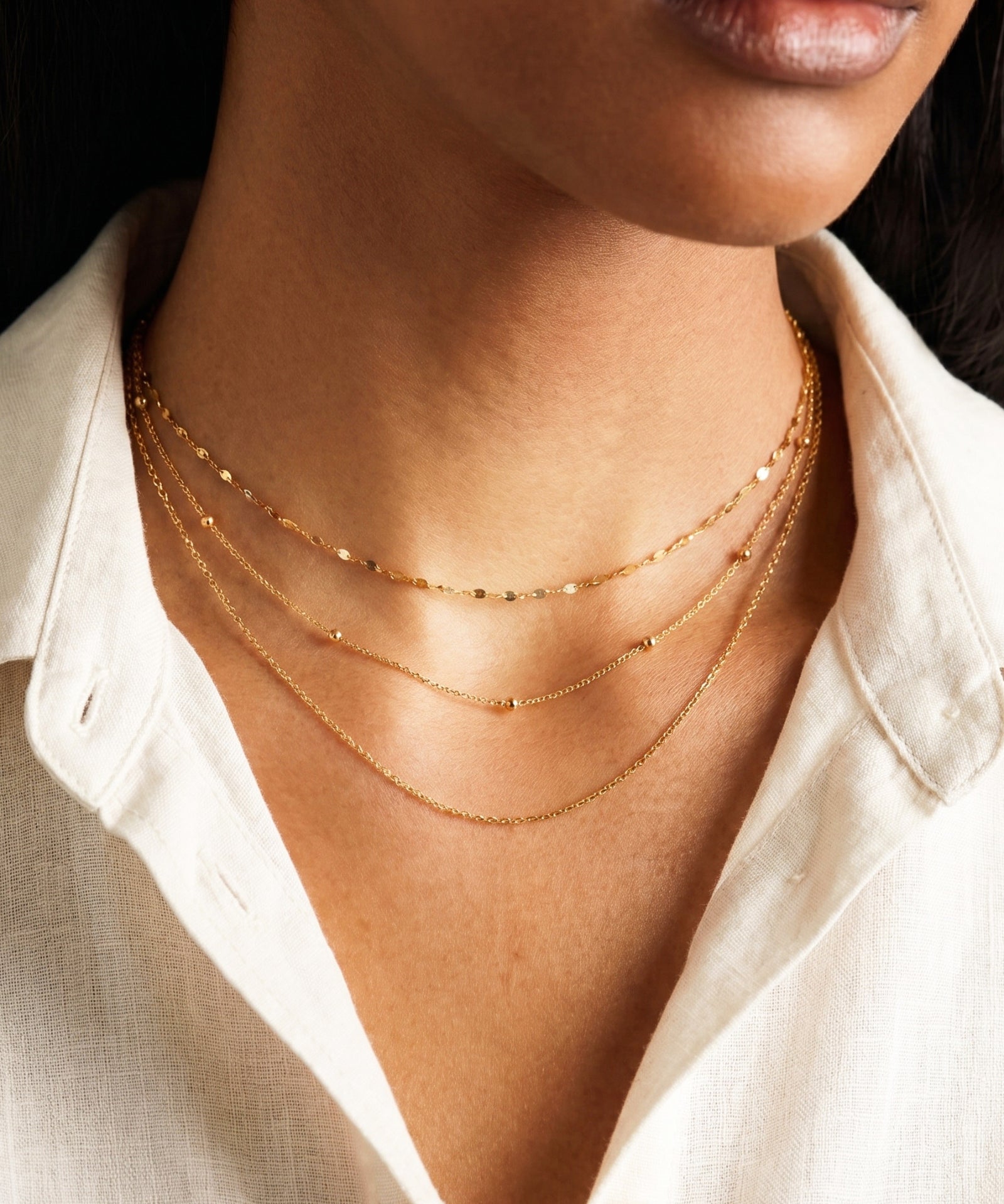 Layered gold satellite chain necklace styled with chain necklace – Amica Jewels