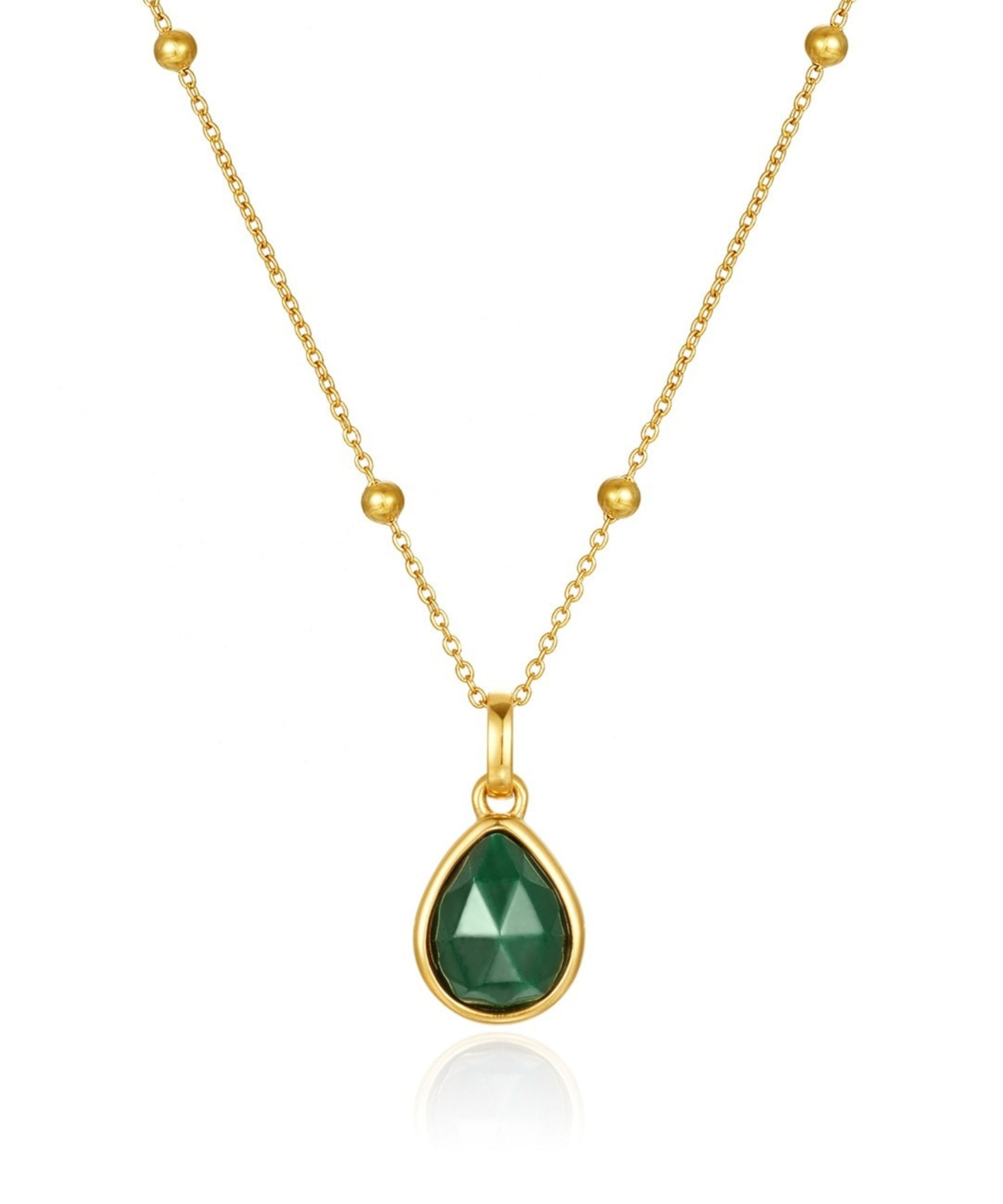 Gold necklace with a green malachite teardrop pendant on a white background