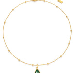 Gold necklace with a green teardrop pendant on a white background