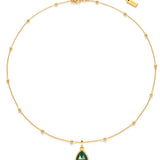 Gold necklace with a green teardrop pendant on a white background