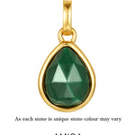 Gold pendant with a green teardrop-shaped gemstone on a white background, featuring the AMICA Jewels brand.