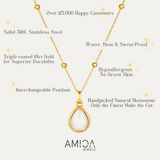 Gold necklace with a teardrop pendant on a white background, featuring AMICA Jewels branding.
