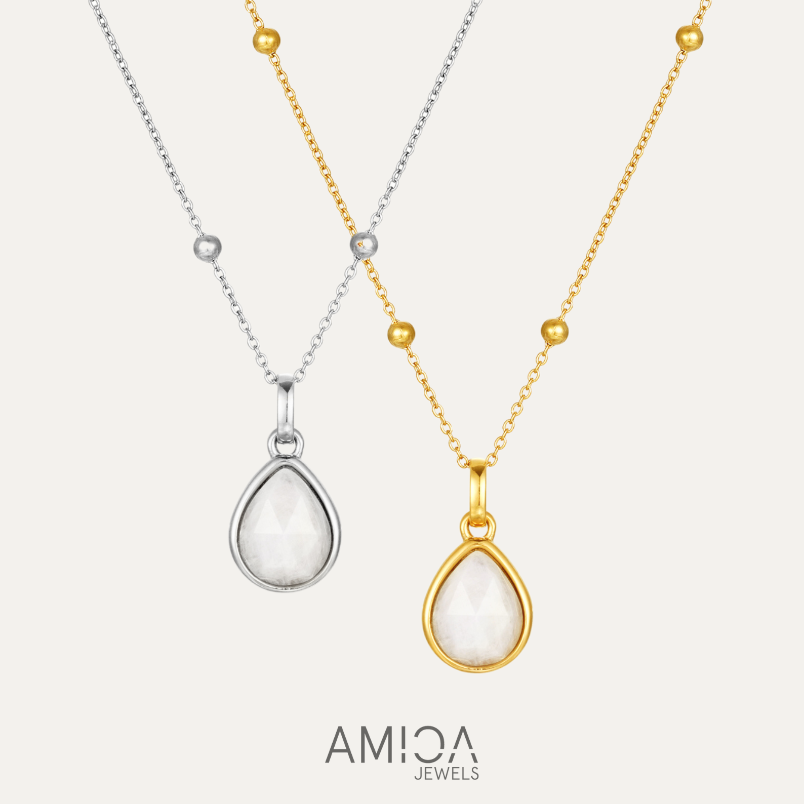 Two necklaces with teardrop pendants, one gold and one silver, on a white background with 'AMICA Jewels' branding.