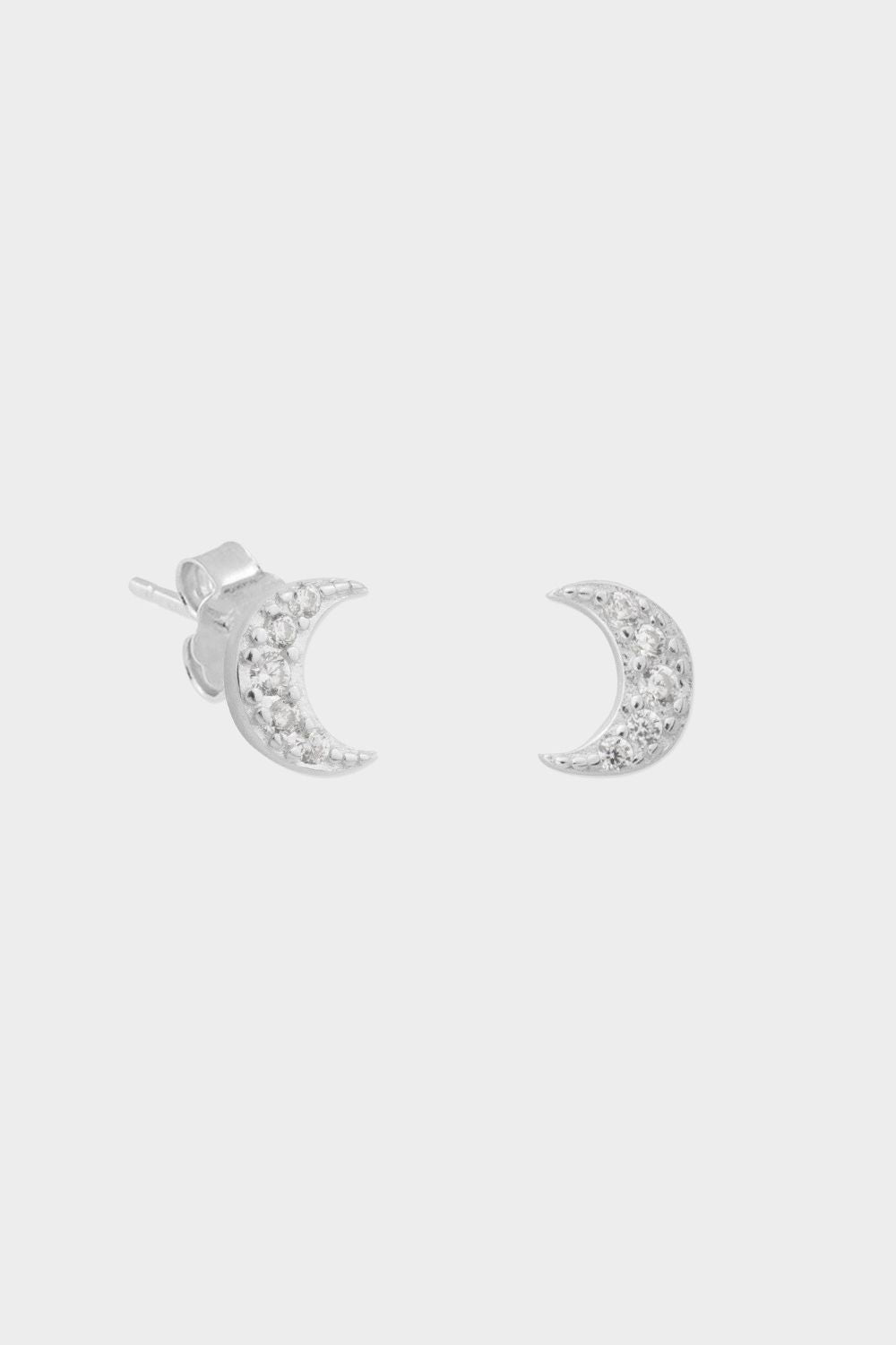 delicate silver moon-shaped stud earrings, perfect for adding a touch of celestial elegance to any outfit