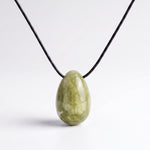 Light green Jade egg-shaped pendant necklace photographed on a white background