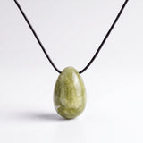 Light green Jade egg-shaped pendant necklace photographed on a white background