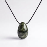 Dark green Southern Chinese Jade egg-shaped pendant on an adjustable black silk cord