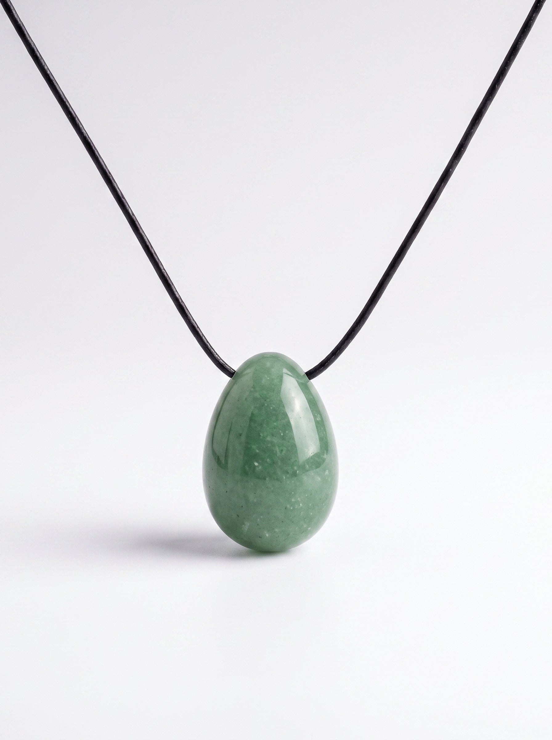 Green Aventurine egg-shaped pendant necklace photographed on a white background