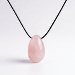 Rose Quartz egg-shaped pendant necklace photographed on a white background