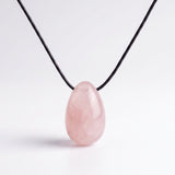 Rose Quartz egg-shaped pendant necklace photographed on a white background