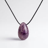 Amethyst egg-shaped pendant necklace photographed on a white background