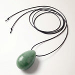 Green Aventurine egg-shaped pendant necklace photographed on a white background