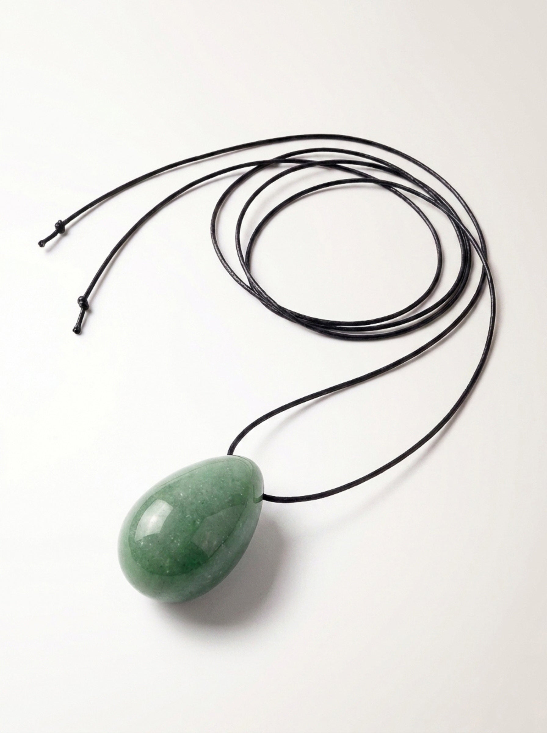 Green Aventurine egg-shaped pendant necklace photographed on a white background