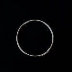 a silver cuff bracelet with a round shape. The bracelet is made entirely of silver, with a smooth and polished finish. This versatile silver cuff bracelet adds a touch of elegance and sophistication to any wrist.