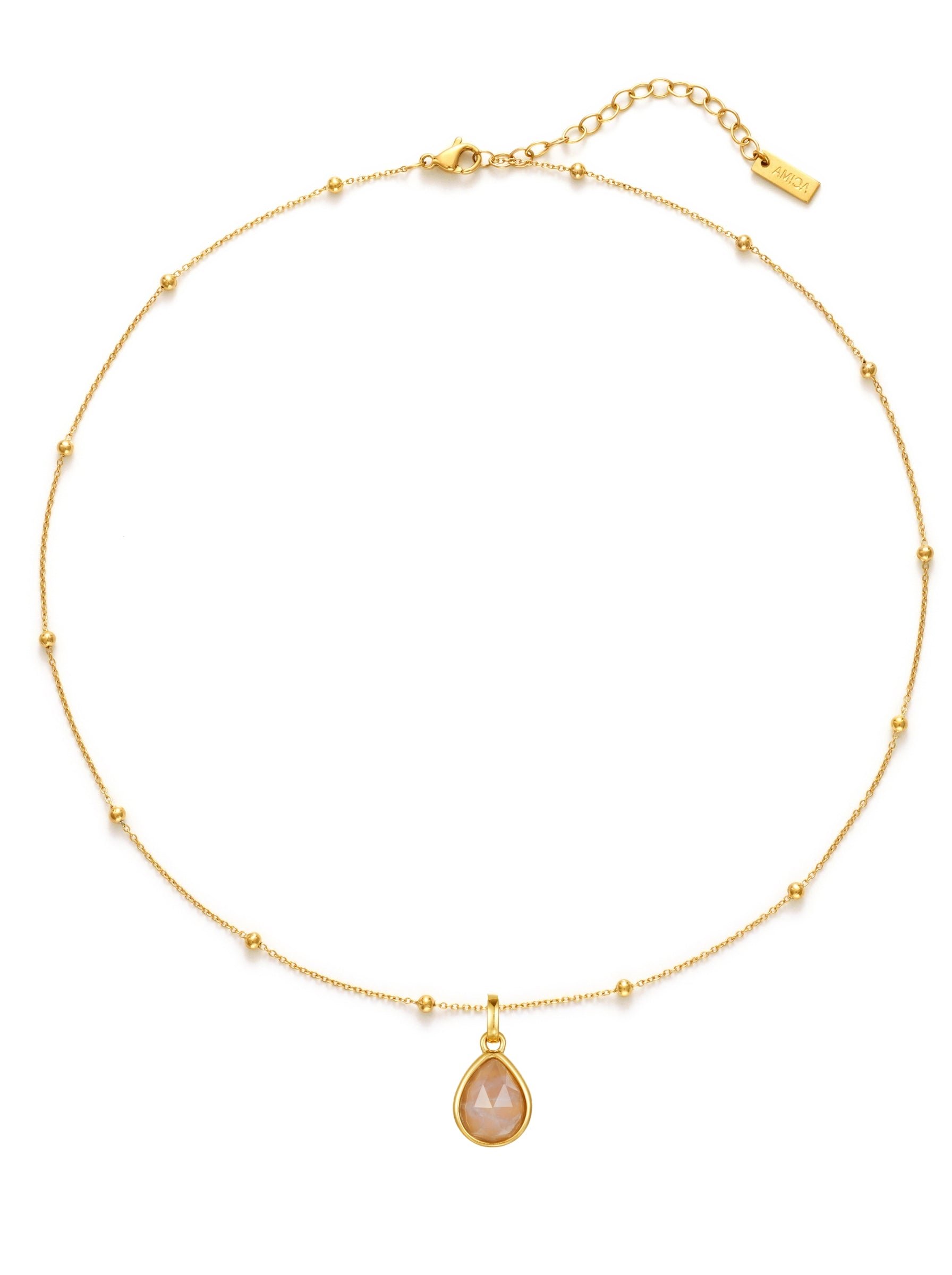 Gold necklace with a teardrop-shaped pendant on a white background